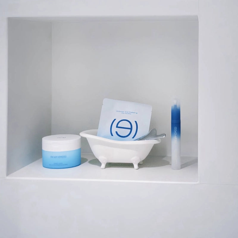 Cosmetic products with a brand logo on a white shelf, In My Eyes